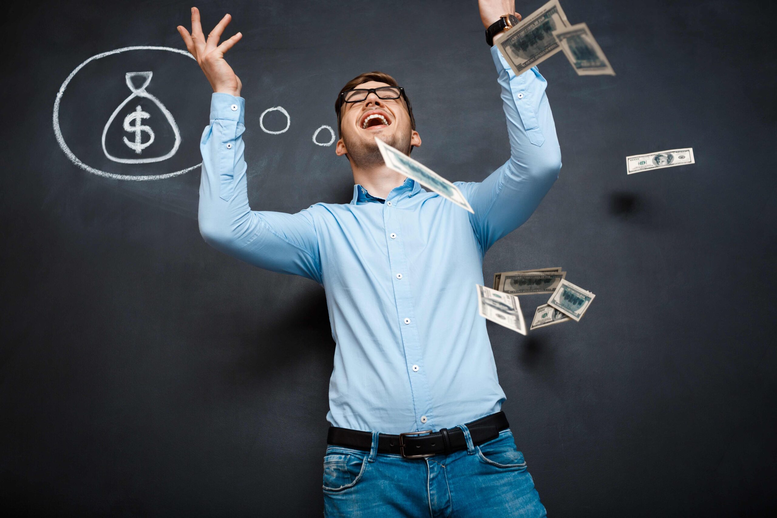 Person celebrating with money falling around them